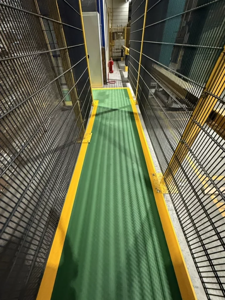 Painted industrial walkway with yellow borders