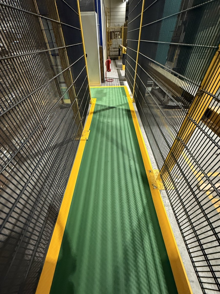 Painted industrial walkway with yellow borders
